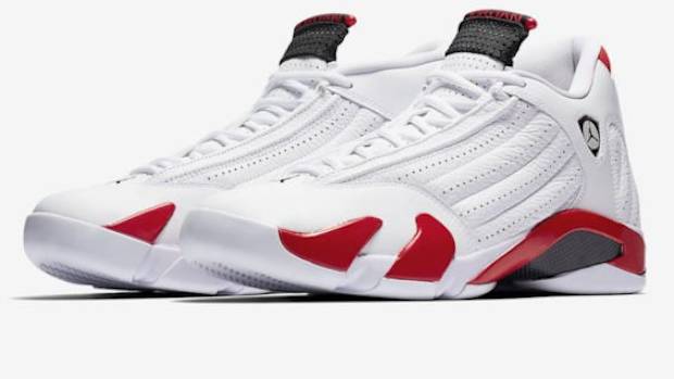 View of white, red, and black Air Jordan shoes.